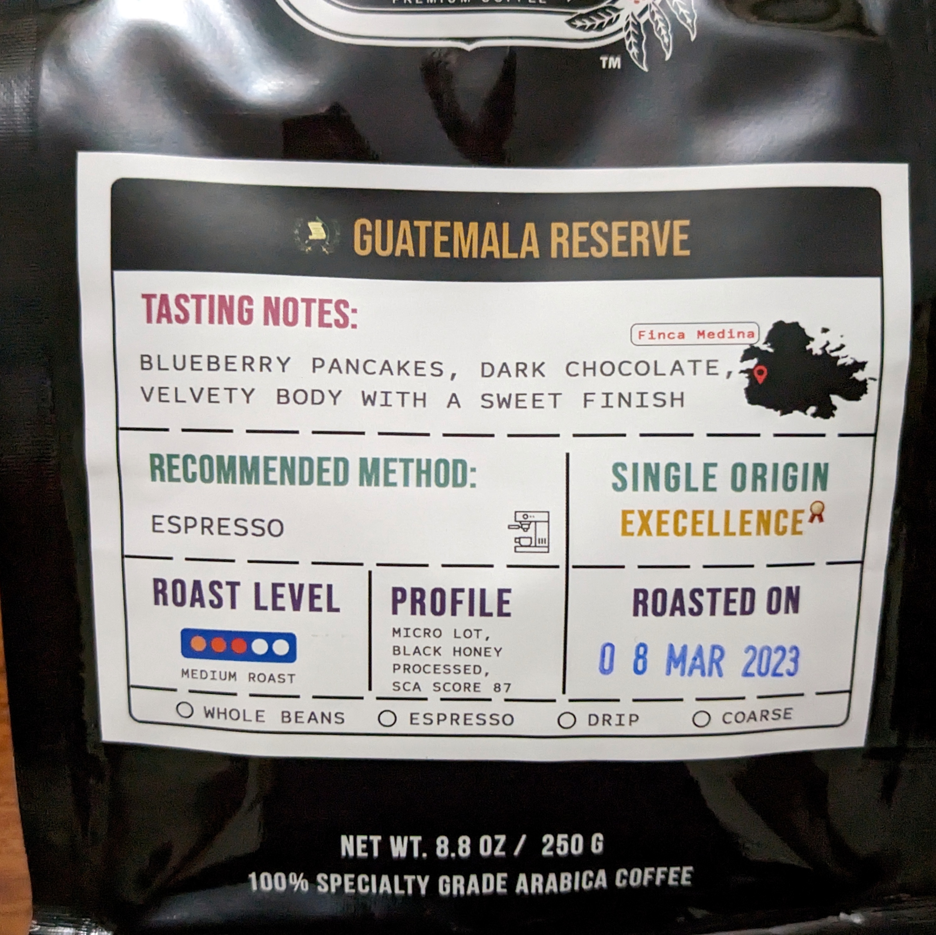 bag of coffee beans from guatemala. taste described as: blueberry pancakes, dark chocolate, velvety body with a sweet finish. 